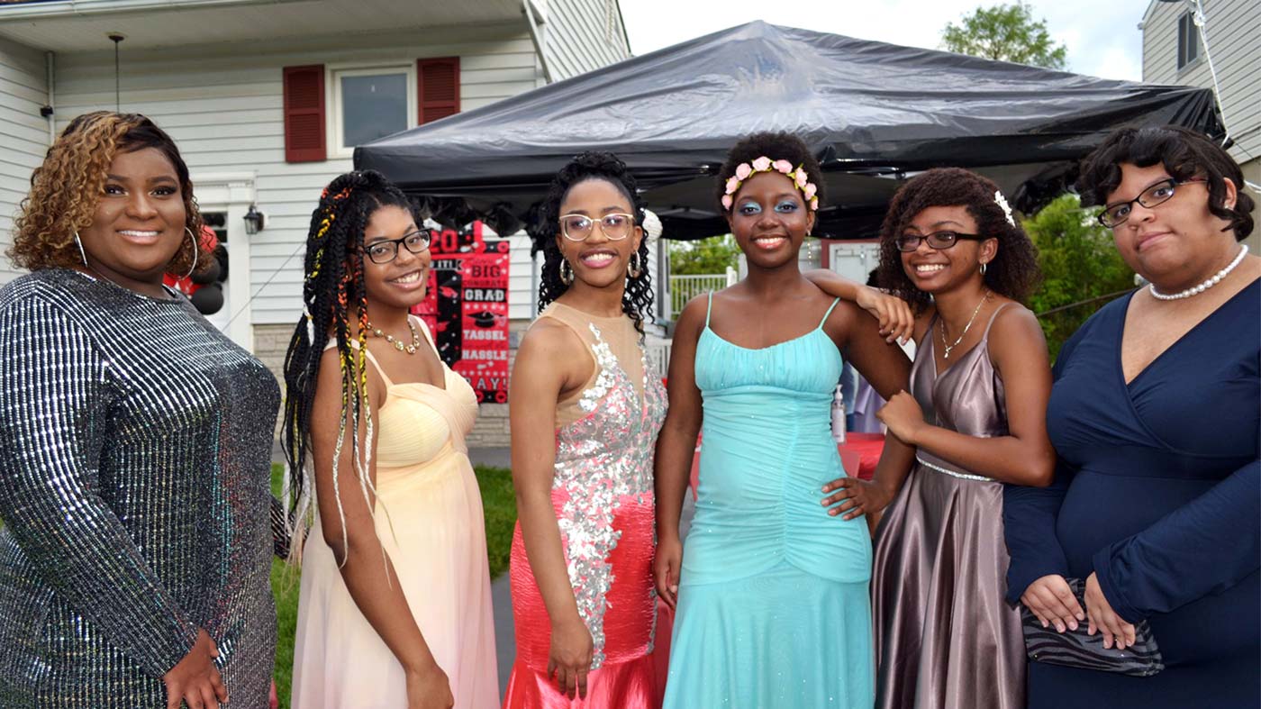 Madison Hall poses for a photo with five friends. The group planned a small party after their senior prom was canceled.