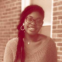 Photo of a dimly lit room with a computer interface terminal.