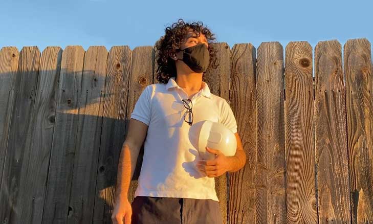 Profile of two essential workers (grocery store/fast food) who are juggling school, work, and the risks of COVID.